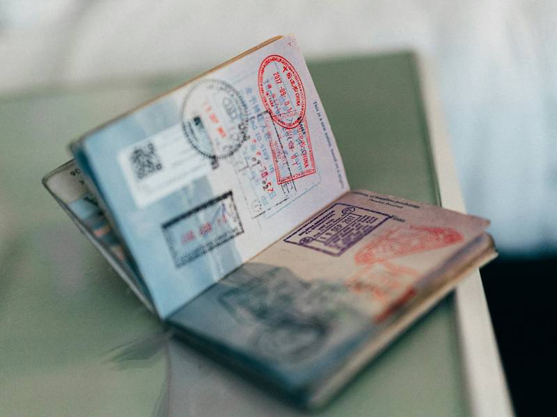Open passport with visa stamps